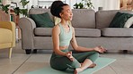 Yoga, meditation and zen and woman on living room floor to relax, breath and meditate at home. Health, fitness and spiritual wellness, black woman with focus working on body and mind in apartment.