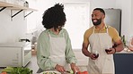 Kiss, cooking and black couple toast with wine while cutting vegetables for delicious and healthy salad. Love, food and romantic man and woman cheers with alcohol in kitchen while preparing meal.