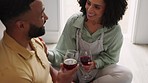 Happy black couple, kitchen and wine with smile on floor, conversation and happiness for drinking in home. Happy couple, love and romance with wine glass, bonding and quality time at house in Chicago