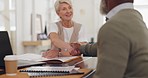 Elderly business people, handshake and b2b for partnership, trust or deal agreement at the office table. Senior woman and man shaking hands for business meeting, interview or welcome at the workplace