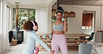 Mother, kid and workout in family home with dumbbells, music headphones and fun exercise tutorial in living room together. Mom, girl child and fitness in lounge for healthy lifestyle, body and energy