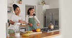 Mother, girl and dance while playing with fruit, having fun and bonding. Care, love and comic, funny and silly mama dancing with child while playing with bananas and oranges together in home kitchen.