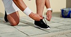 Man, hands and shoe lace tie in city fitness, workout or training for healthcare wellness, cardiovascular strength or marathon. Zoom, running shoes or sports runner athlete on ground with smart watch