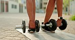 Fitness, dumbbell and man doing lunge workout outdoor by apartment with weights for strength. Sports, motivation and strong male athlete doing muscle training with arm exercise with sport equipment.