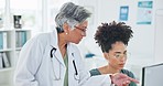 Doctor, receptionist and office planning at computer for patient update, communication and schedule check. Senior medical professional in conversation with employee working at reception pc in clinic.