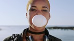 Funny, face and bubble gum with black woman and travel, adventure and playful outdoor, adventure and gen z youth. Trendy, fashion and candy bubble, comic portrait and chewing gum, holiday in Canada.