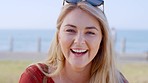 Happy woman, face and beach promenade travel background while laughing at funny thought outdoor for fun summer vacation. Portrait of female from Australia with a smile, happiness and freedom