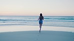 Woman, running and beach for summer, relax and holiday for wellness, health and peace. Female, girl and runner enjoy seaside vacation, run and enjoy view for travelling, weekend break and freedom.