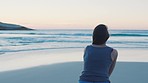 Freedom, ocean and woman running on beach, having fun and enjoying holiday. Back, water and carefree female sprinting at sea for swimming, exercise or workout at sunset outdoors on break for wellness