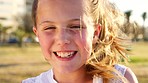 Child face, laughing and girl portrait from Miami in summer with happiness outdoor on a grass field. Vacation, freedom and happy kid on holiday excited about nature park with funny youth smile 