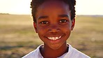 Black child, boy and face at sunset in nature park, Congo garden or sustainability environment on school trip. Portrait, zoom and happy smile for kid, climate change accountability or responsibility