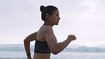 Running, energy and fitness with woman at beach training for marathon, endurance and sprinting stamina. Fast, cardio and intense with girl runner and exercise for sports, workout and performance