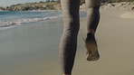 Legs, woman running and beach fitness workout for sports marathon motivation or training zoom. Runner, athlete female and cardio run on Cape Town ocean seaside for freedom, wellness and exercise