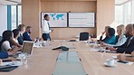 Corporate, business people and map analytics presentation in boardroom with interracial workforce. Business meeting, communication and black man presenting statistics analysis in Chicago, USA.