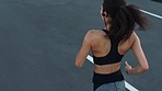 Back view, fitness or black woman running on road training for a marathon in cardio exercise or workout in New York. Street, sports or healthy girl athlete runner on a fast jog with speed or freedom