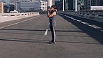 Fitness, city and woman stretching in the street before an outdoor workout on the highway. Sports, health and female athlete doing warm up exercise to get ready for training in the road of urban town