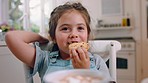 Cookies, food and girl eating in kitchen, fine dining and having delicious meal in home. Face, biscuits and happy child chewing cracker, smiling and enjoying breakfast dessert in the morning in house
