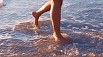 Travel, summer and woman feet at beach for peaceful holiday walk leisure in water at sunset. Freedom, vacation and wellness of girl barefoot in ocean paradise for relaxing getaway in nature.