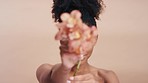 Beauty, skincare and flowers with face of black woman for natural cosmetics, tropical and spring bloom. Glow, floral and makeup with girl model and orchid plant for treatment, wellness and spa