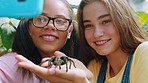 Spider, friends and phone with girl in zoo and selfie for learning, environment and social media. Nature, education and ecosystem with students and tarantula in wildlife sanctuary for conservation