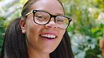 Girl, teenager or laughing face and glasses, vision or innovation ideas in coffee shop, cafe or restaurant with leaf plants. Zoom, portrait or happy smile on education student in Brazilian learning