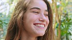 Face, smile and girl in nature on vacation, holiday or trip outdoors. Freedom, travel and smiling female teenager from Canada in zoo, garden or forest on adventure, enjoying time alone and having fun