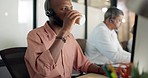 Man, drinking coffee and computer in call center, telemarketing coworking office or contact us company. Receptionist headset, men and woman on technology in sales consulting or customer support help