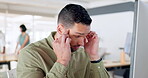 Creative businessman, headache and computer tired from working in stress, depression or mental health at the office. Man employee designer suffering burnout, head pain or ache in anxiety at workplace