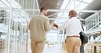 Creative businessman, fist bump and walking at the office in success for deal, meeting or greeting. Employee men walk while fist bumping in partnership, friendship or agreement for corporate startup