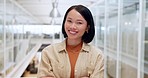 Pride, arms crossed and face of a business woman with corporate vision, success and motivation. Happy, expert and portrait of an Asian employee with a smile, confidence and empowerment at work