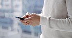 Man, phone and smile typing conversation by window in apartment for social media posts, reading online communication or digital networking. Asian man, happy and working on smartphone mobile app 