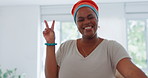 Creative black woman, face and smile with peace sign for fun friendly workplace walking in the office. Happy African American female employee smiling and blowing kiss in happiness for career startup