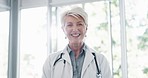 Face, senior woman and doctor for healthcare, wellness or medicine. Mature female, portrait or medical professional with smile, leader or confident with uniform, stethoscope or motivation in hospital