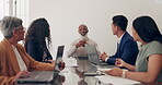 Leadership, CEO or black man in a meeting with business people talking or speaking of kpi, target or company goals. Mentor, diversity or senior manager talking or planning a project with employees 