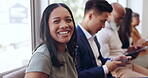 Face, interview and recruitment with a business black woman waiting in line to see human resources. Portrait, happy and smile with a female employee sitting in a row during a work hiring process