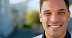City, happy businessman and face with smile expression against a blurred urban background. Portrait of a young latino male manager or executive in corporate job smiling in success on a break outdoors