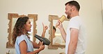 Love, happiness and couple singing in bathroom with brush and hairdryer, fun while getting ready in morning. Hair, song and dance, man and woman dancing together in happy marriage or relationship.