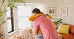 Moving, couple and man with keys for woman, hug and real estate success, happy and smile in their new house. Property, purchase and young homeowner sharing good news with girlfriend about home loan