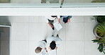 Business people, collaboration and walking in modern office with top view for partnership discussion, teamwork and planning corporate strategy. Business team, walk and employees talking together