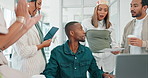 Applause, collaboration or motivation with a business black man and his team in an office working on a project. Planning, presentation or strategy with a man and woman employee group clapping at work