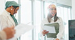 Business women, teamwork or diversity meeting on paper or documents review in coaching or training feedback. Smile, happy or talking speaker in leadership workshop, collaboration or strategy planning