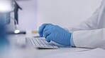 Doctor, hands and gloves typing on keyboard for research, medical data or browsing on computer at office desk. Hand of healthcare professional or scientist working on PC for online science discovery