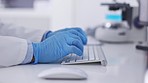 Hands, computer and scientist typing for analysis, innovation and research for healthcare or online development. Zoom, blue gloves and device for digital planning, search internet and keyboard in lab