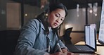 Woman, writing and office in night, planning and focus at desk for strategy, target and kpi in marketing. Asian corporate executive, notebook and computer for vision, mission and schedule in Tokyo
