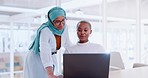 Laptop, discussion and business people working on a project together in the modern office. Communication, corporate and muslim manager helping a black woman employee on a computer in the workplace.