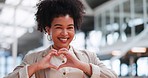 Black woman with hand heart, face and career love, happy with corporate business and professional success. Modern office, happiness and vision, sign with hands and pride in job, portrait in workplace