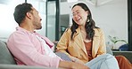 Break, laughing and business people in communication at work, happy and funny conversation. Smile, entrepreneur and Asian employees talking about a comic story, smiling and speaking on a sofa