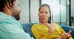 Conversation, communication and black people on a work sofa for a meeting, planning and break. Teamwork, trust and corporate friends talking about ideas, business discussion and trust in an office