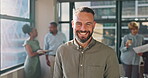 Face, happy and smile with a business man at work, standing in his office with a vision for the future. Motivation, goal and trust with a male employee working towards a target or mission goal