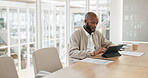 Businessman thinking, working with tablet and typing email or internet research for business project in conference room. Black man, employee and writing with technology, online and folder with ideas